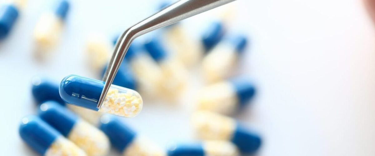 Pharmacist,Holding,Tweezers,Pill,Closeup,Medical,Background,Concept Before a medicine is registered by the South African Health Products Regulatory Authority, it undergoes years of laboratory research and clinical trials to demonstrate its safety, effectiveness and quality. (Photo: Shutterstock)